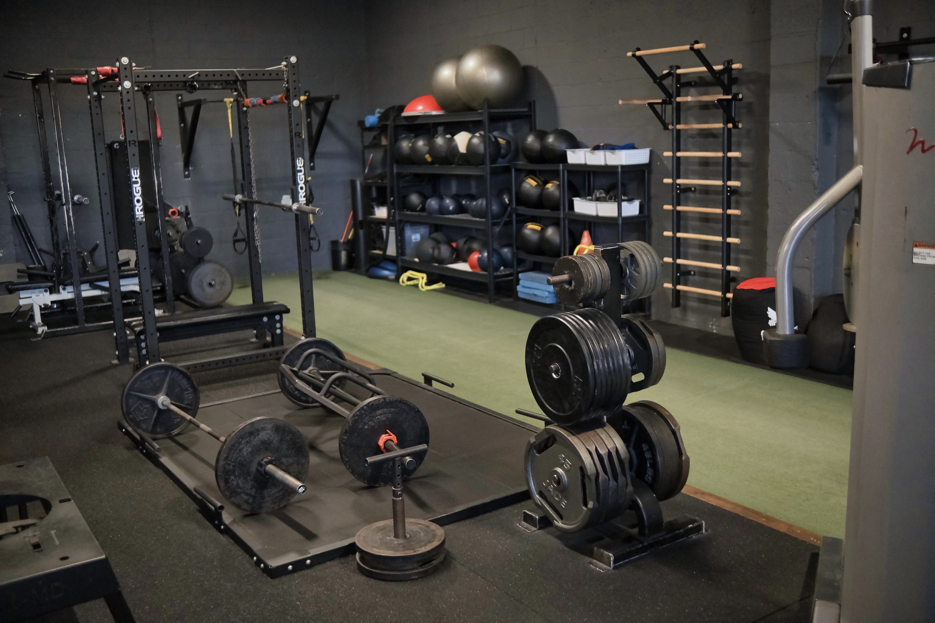 Training floor with weights and racks