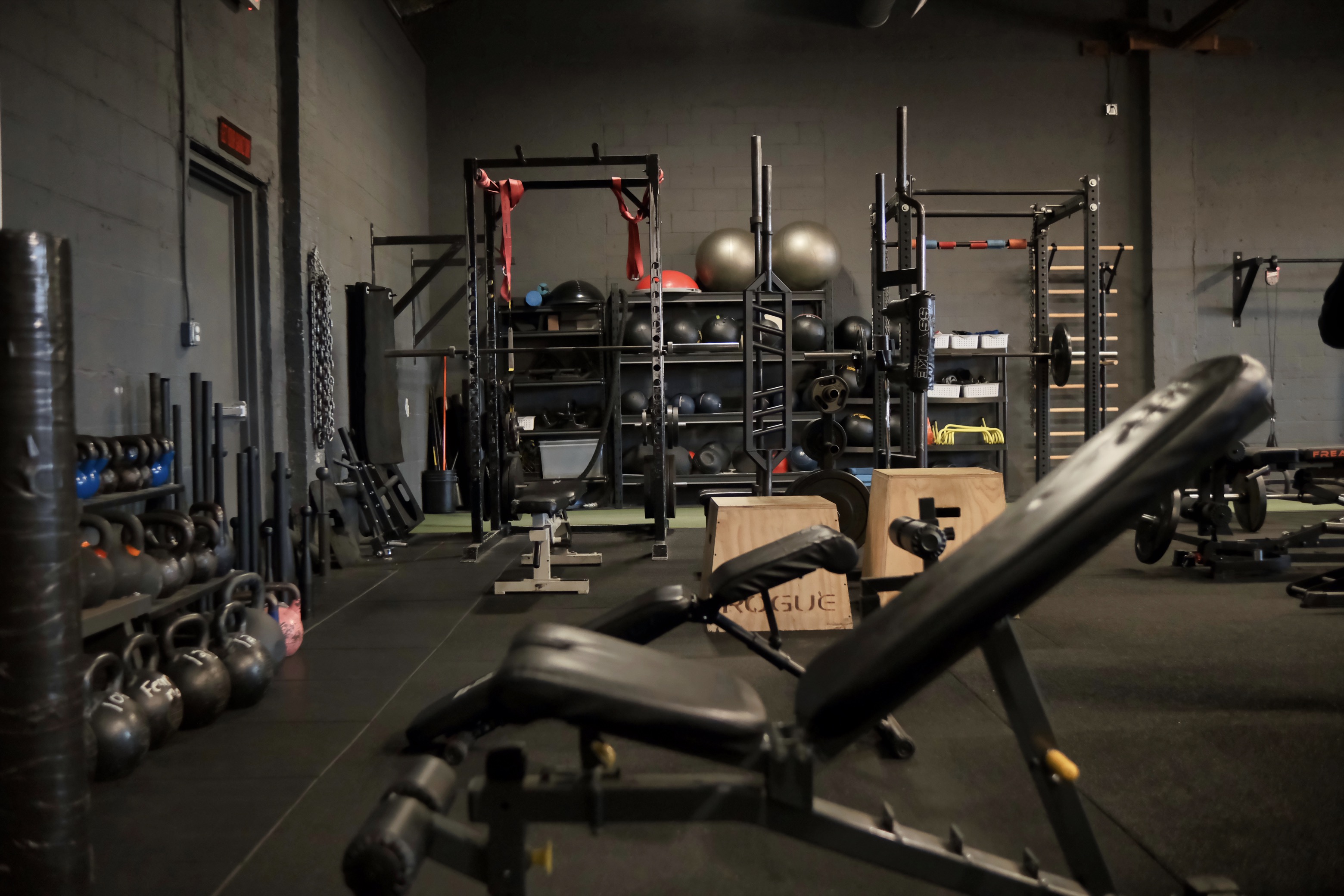 Full gym layout with multiple training stations